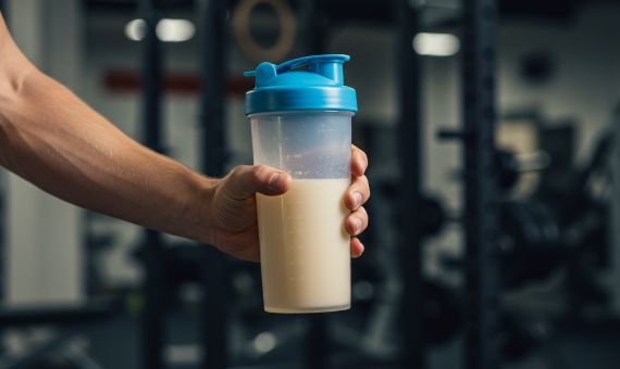 boost your metabolism signe with red apple, a weight and tape measure 