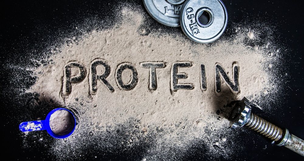 protein word written on a protein powder